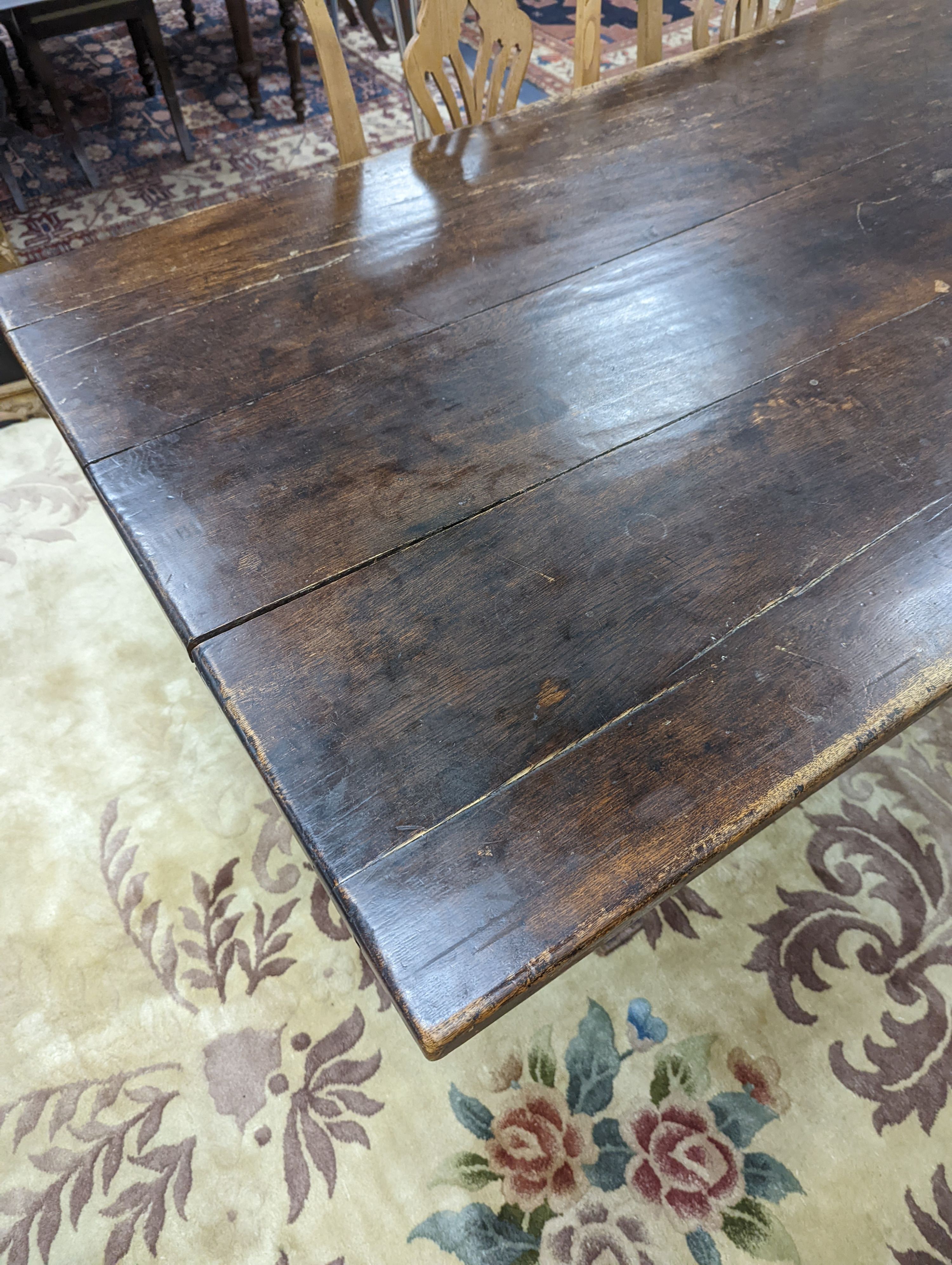 A 17th century style rectangular oak refectory dining table. Length -183cm, Width-91cm, Height-74cm.